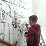 Roger Mason painting mural in Dalston