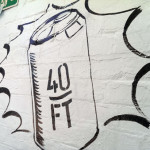 Roger Mason painting mural in Dalston